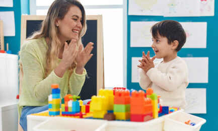 Early Childhood Educator working with a young child to build resilience skills and confidence